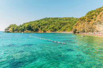 Fototapeta premium Fragment of Mogren beach in Budva, Montenegro is one of the most popular beaches on the Budva Riviera.