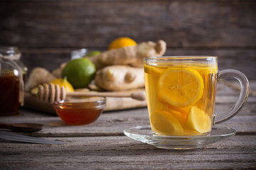  Ginger tea and ingredients on a  grunge wooden background