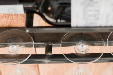 Iron stand for glasses on a wooden base in the loft style