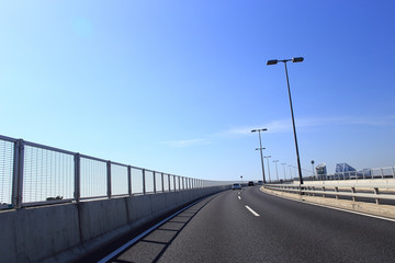 Car driving on the Tokyo Gate Bridge