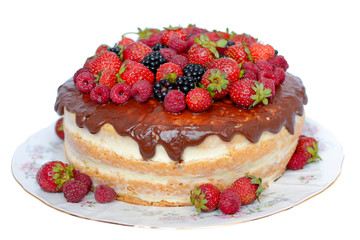 Cake in chocolate glaze with fresh berries on white background.