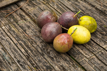Fresh passion fruit on old wooden background