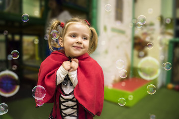 Cute blonde little girl wearing Red Riding Hood costume