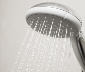 Naklejka na ściany i meble Shower head with water drops