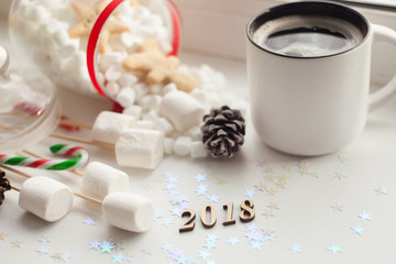 Wooden number 2018 with white coffee cup, Happy New year day celebration