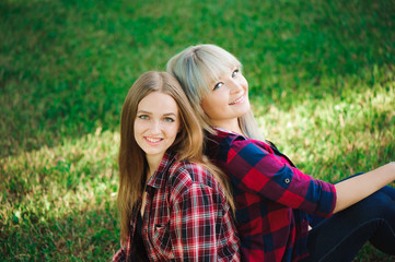 Fototapeta premium Two friends smiling outside