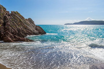 Beautiful sea view. The mountain goes into the sea. Calm sea on a sunny day. Adriatic Sea. Montenegro