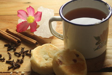 tea time with traditional pastry on the wooden table