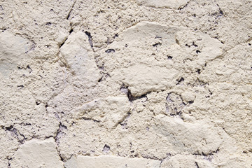 detail of beige rough wall, closeup, Santorini Greece.