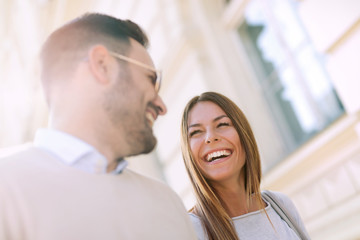 Smiling couple in love outdoors.Young happy couple walking on the city street.