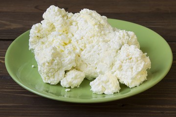 fresh suckling curd is in a green dish