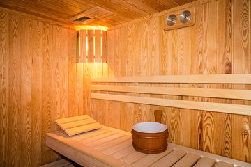 Obraz na płótnie Canvas Interior of a wooden bed in a home sauna