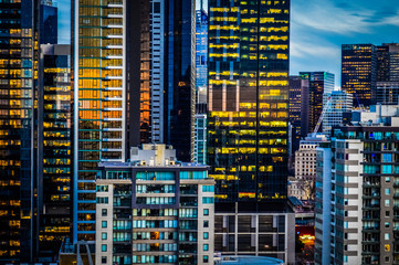 Fototapeta na wymiar Glowing Towers of Melbourne Skyline at Dusk