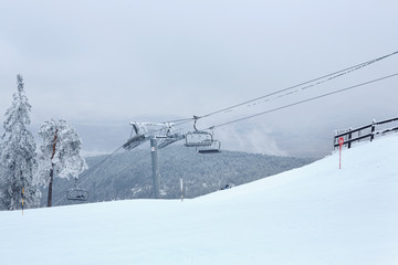 Fototapeta na wymiar winter mountain landscape with modern ski lift.