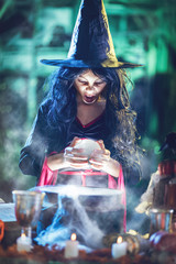 Young Witch Watching The Future In Magic Ball