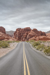 panoramic view of hot summer road goes through the valley in nevada