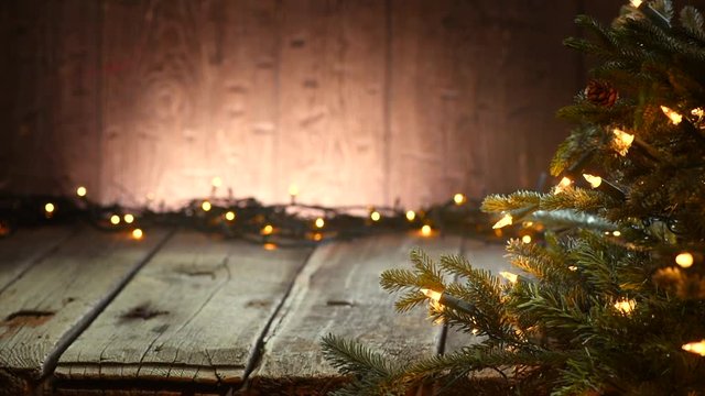 Christmas holiday background, Decorated tree and garlands over wooden background. 4K UHD video 3840x2160