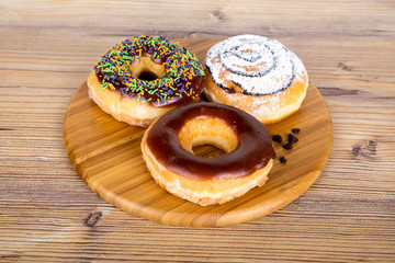 Yummy Donut on Wooden Background