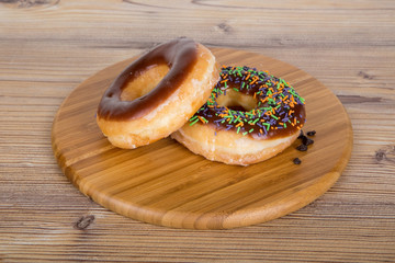 Yummy Donut on Wooden Background