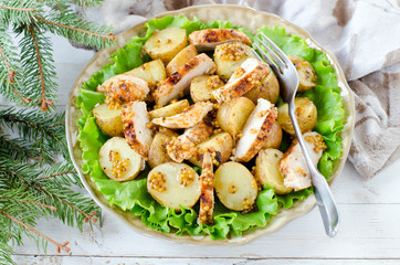 Warm salad of chicken and potatoes with mustard dressing