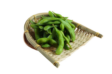 Isolated Frozen edamame beans in the basket on washi (Japanese paper). ready to serve at Japanese restaurant in Bangkok, Thailand.