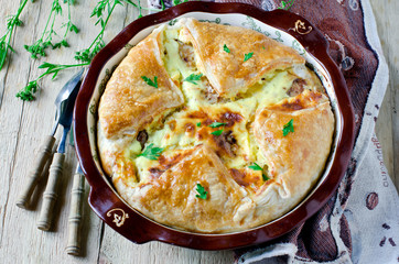 Pie with meat and cheese