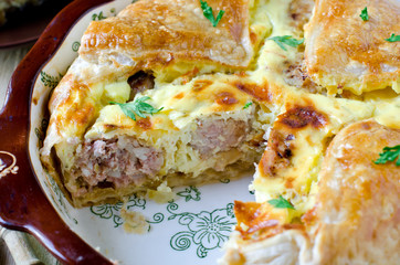 Pie with meat and cheese