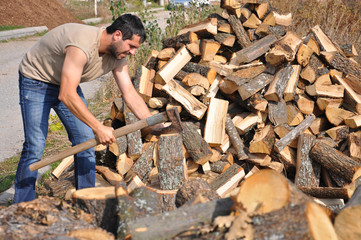 Lumberjack chopping wood for winter, Lumberjack chopping woods with old ax