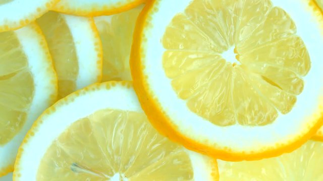 Closeup of a delicious ripe lemon rotate. 4K UHD video 3840x2160