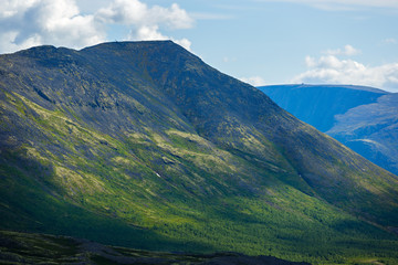 Fototapeta premium The tops of the Mountains, Khibiny and cloudy sky. Kola Peninsula, Russia.