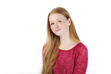 Beauty portrait of young adorable fresh looking redhead woman with freckles gorgeous extra long hair. Emotion and facial expression concept.