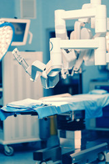 Surgical room in hospital with robotic technology equipment, machine arm surgeon in futuristic...