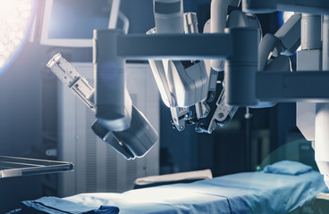 Surgical room in hospital with robotic technology equipment, machine arm surgeon in futuristic...