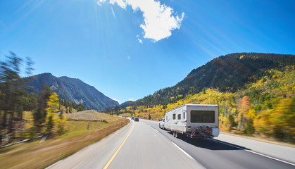 camper on road trip on road