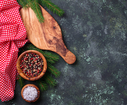 Christmas cooking background with cutting board and spices