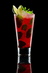 Cold tasty cocktail  with gin and cherry juice with reflection on black background