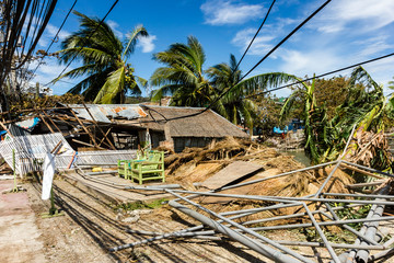 Fototapeta na wymiar Wooden buildings completely destroyed by the passage of a major hurricane / super typhoon