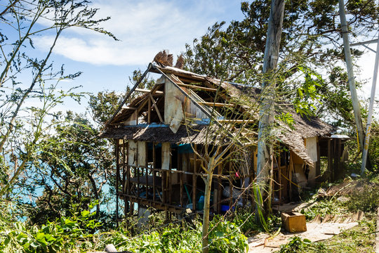A small wooden house completely destroyed by the passage of a super typhoon / major hurricane