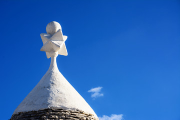 Tip of the roof of a typical Apulian trullo - obrazy, fototapety, plakaty