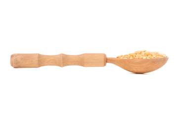 Wooden spoon with peas