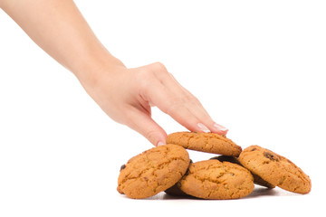 Female hand holding cookies with raisins isolated