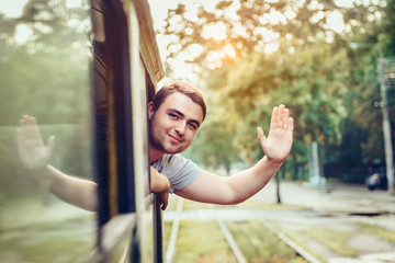 Happy man enjoy to use public transport in the city
