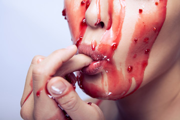 Sexual model suck her finger and eat jam on her face.