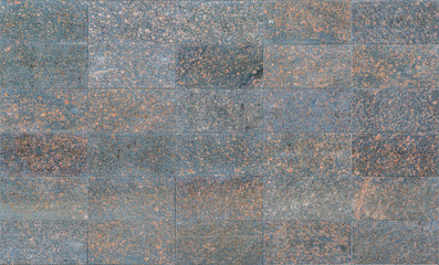 Black granite tiles with disseminations of red stones as background or texture