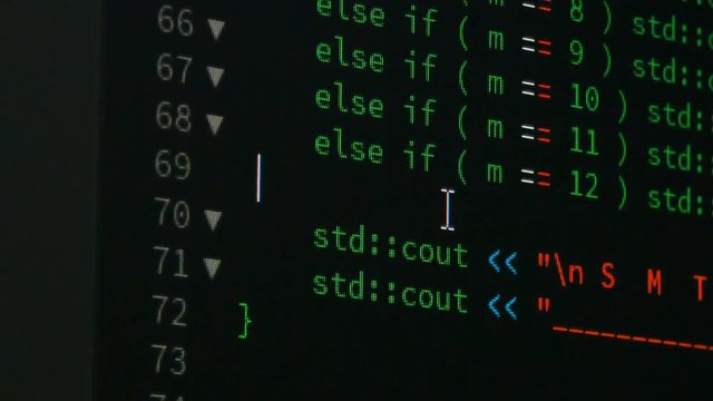 Programmer scrolling up and down and checking code for editing futuristic technology concept with grain and dark tone processed