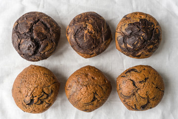 six fresh delicious vanilla-chocolate muffins, top view