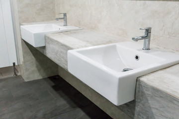 Fototapeta premium Minimal style bathroom with two sinks and granite top