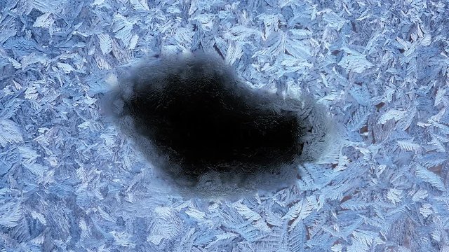Beautiful frozen window melting animation from center to borders, timelapse defrost transition, natural dissolve, isolated on black background with black and white luminance matte, alpha channel.