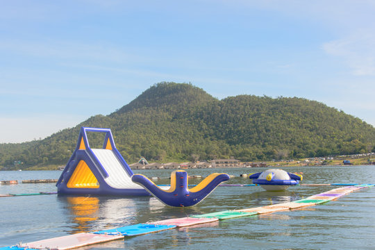 Inflatable Water Park On The Lake With The Mountain In The Background,kanchanaburi,thailand