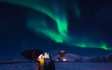 The polar arctic Northern lights aurora borealis sky star in Norway Svalbard in Longyearbyen man...